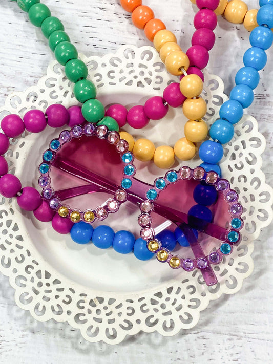 Rhinestone glasses with multi color stones on a berry colored frame