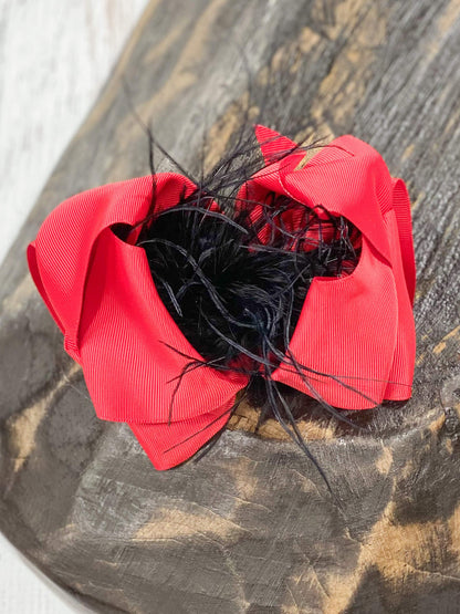 These Texas-size red and black ostrich feather puff hair bows are perfect for your mini all year round. Pair it with any cute outfit for sporting events, family pictures, or holiday events.