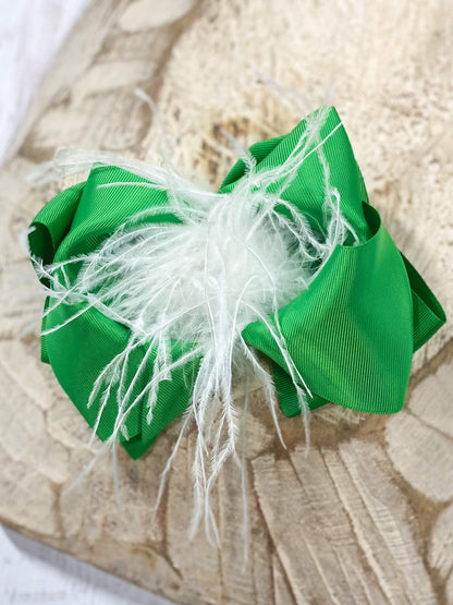 These Texas-size green and white ostrich feather puff hair bow are perfect for your mini to wear this coming holiday or any day!