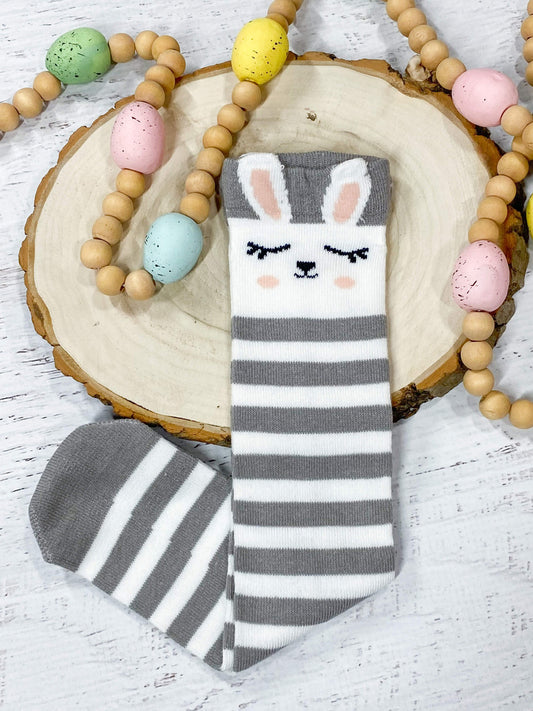 White and grey bunny tube socks for girls with adorable eyes closed bunny face and ears at the top. Fits approximately 2-10 years.