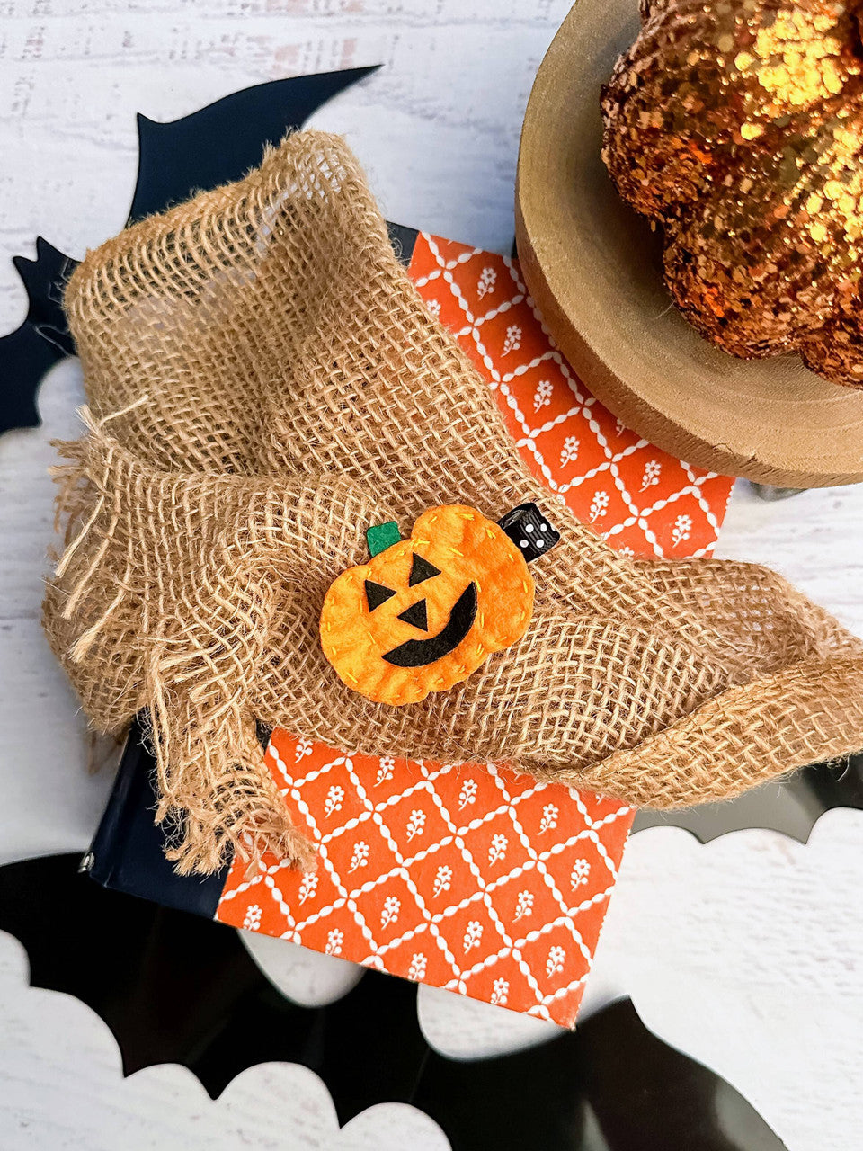 Cute felt orange Jack-o-Lantern pumpkin clippies with stitch details around the edges and green stem. Whether she's sporting her newest Halloween outfit, or you're looking for a fun embellishment for Halloween party goodie bags, you can't go wrong with this adorable hair clip! Get two to wear on pigtails! Each clip is about 2.5-3" long and is affixed to an alligator clip lined with orange with white polka dot ribbon.