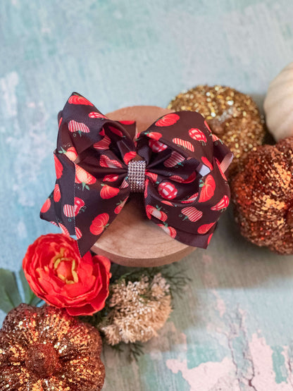 fall hair bow with pumpkins and rhinestone center