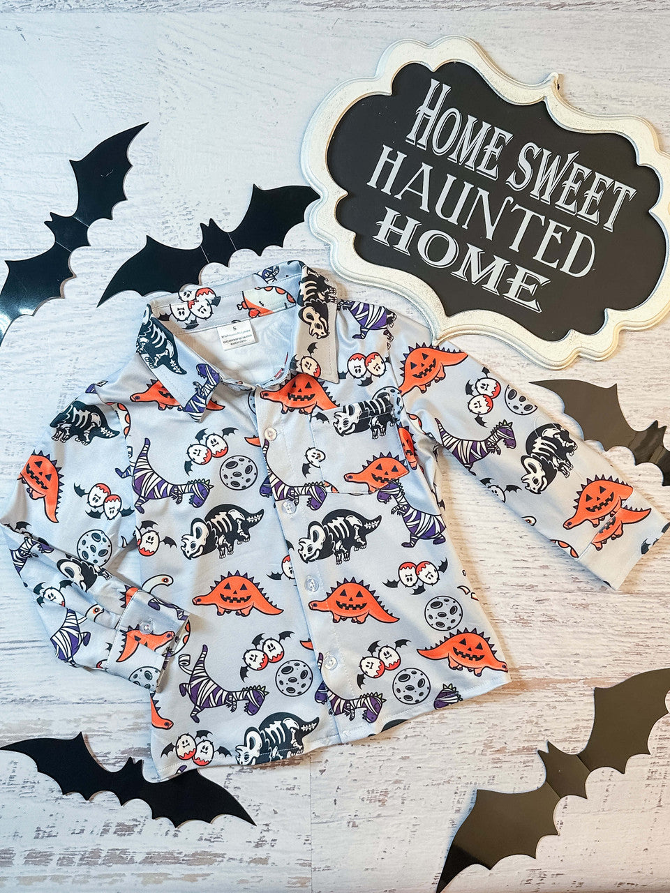 gray button down shirt with halloween dinosaurs