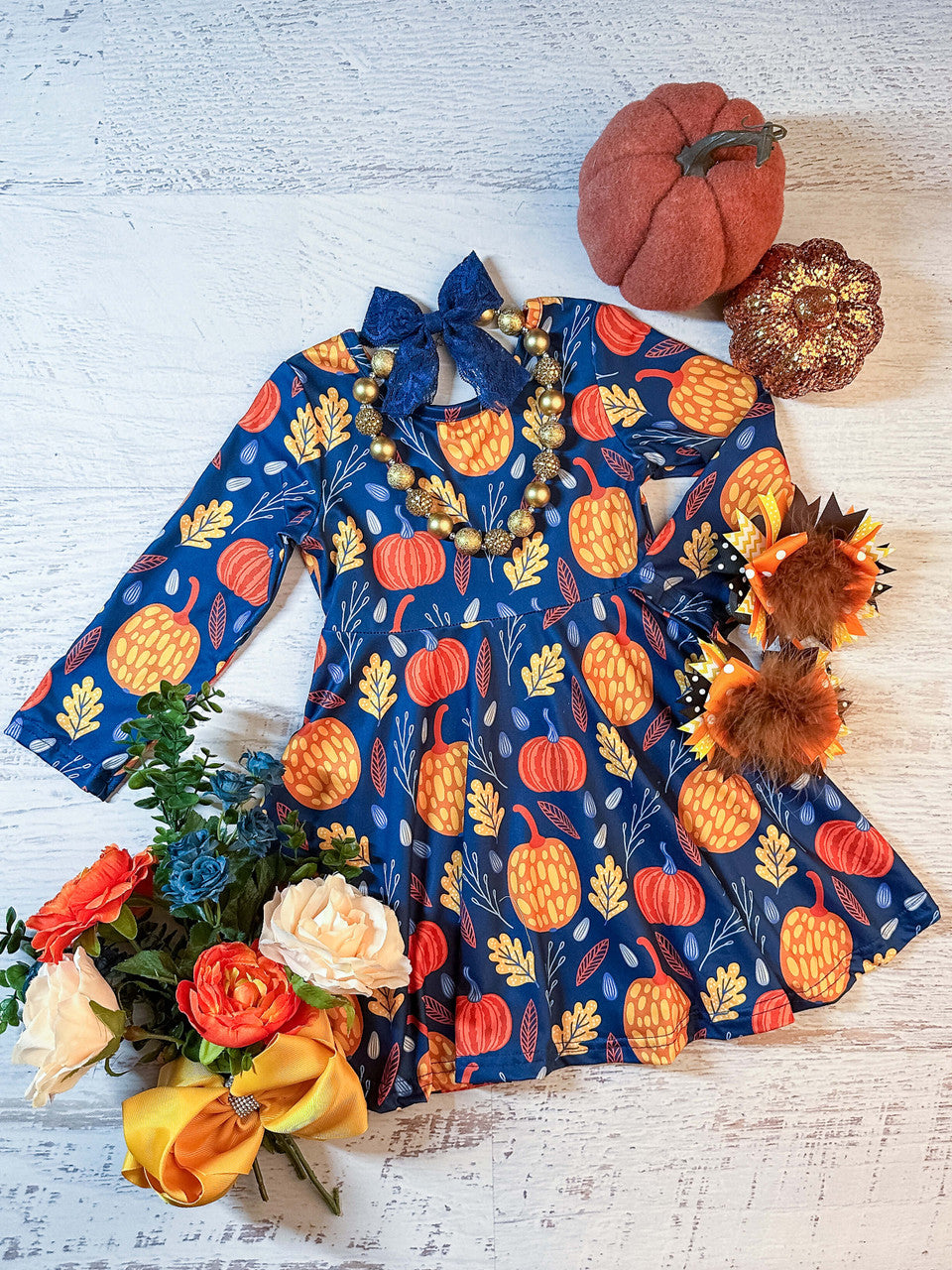 blue long sleeve twirl dress with elegant pumpkins and leaves