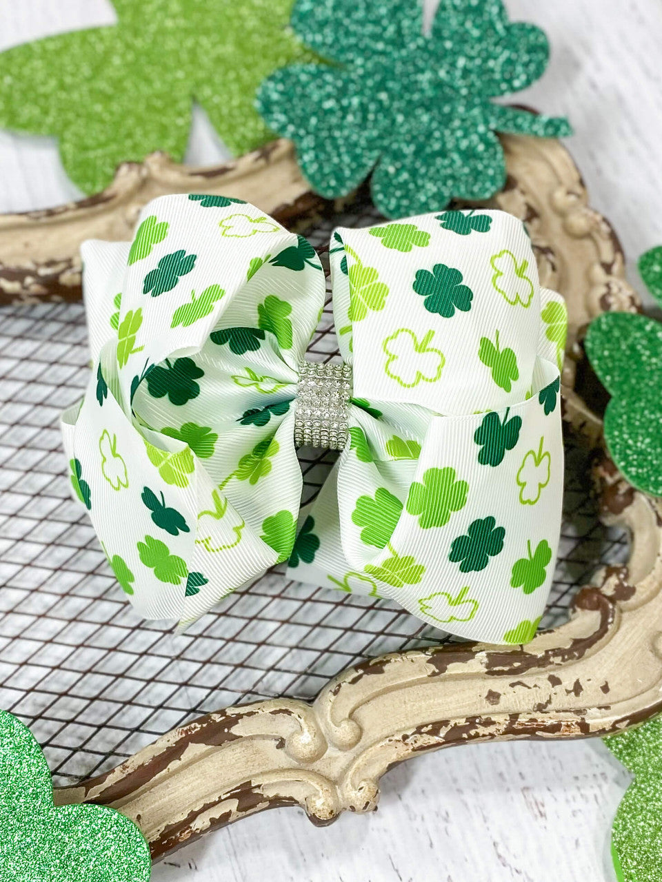 Green Shamrock print on our popular Texas size rhinestone center big bow.