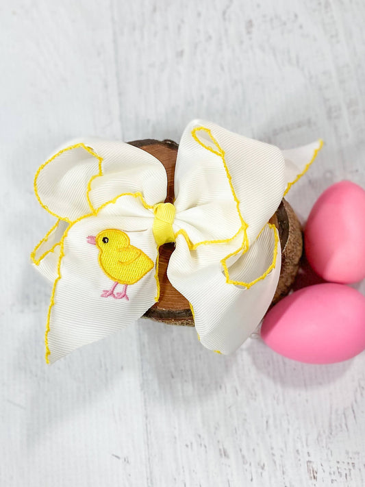 White with yellow moonstitch hair bow with embroidered chick design on left tail