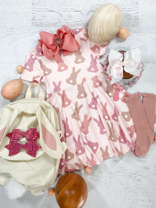 Rose pink, light brown, and white bunny tail easter bunny pattern twirl dress.