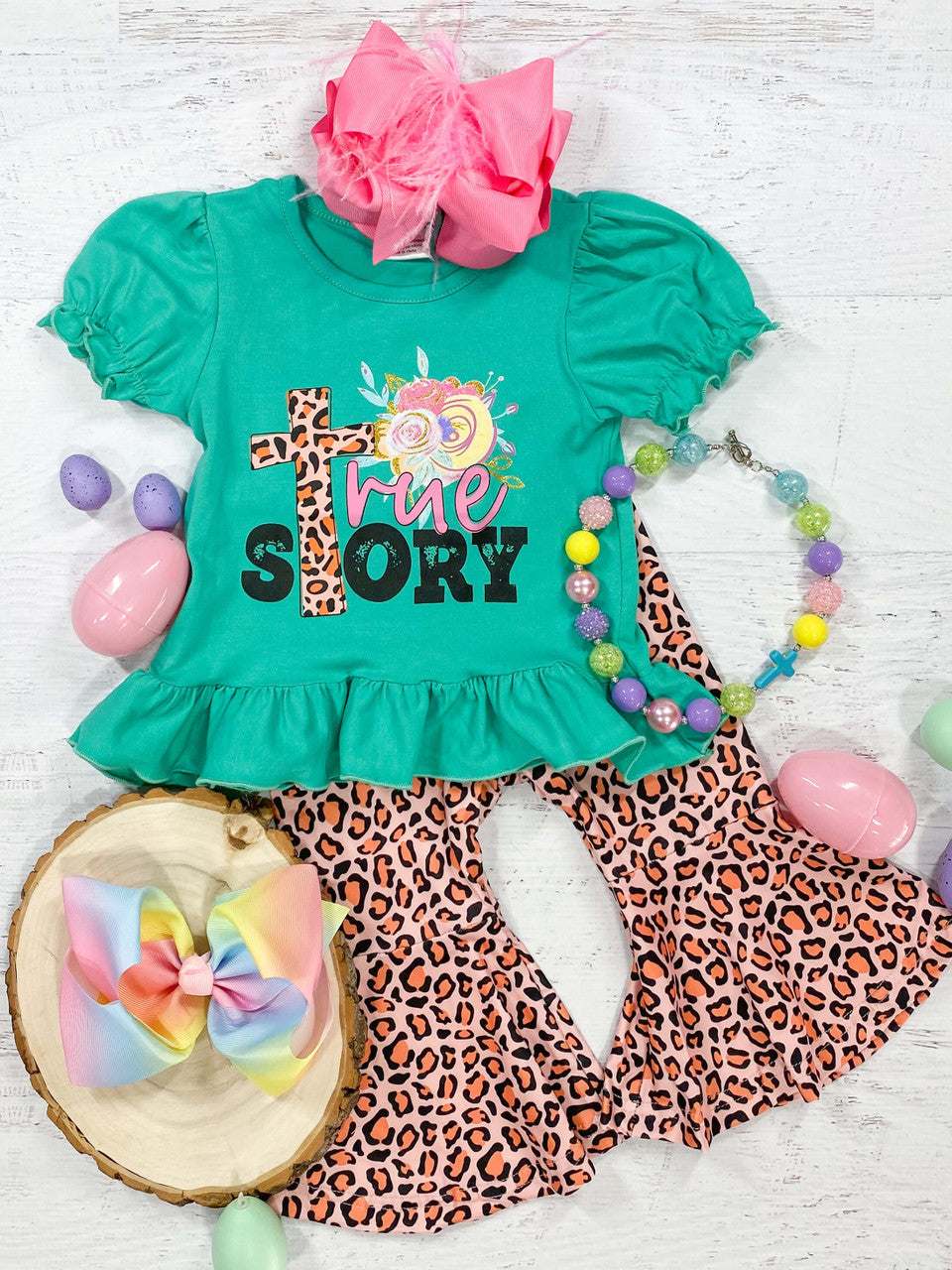 True Story with animal print cross, abstract floral pattern, and green puff short sleeve with ruffle easter top paired with animal print bell bottom set.