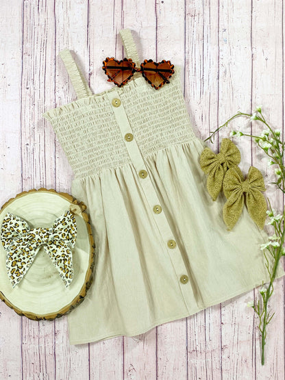 Linen sundress with a smocked top and buttons down the center