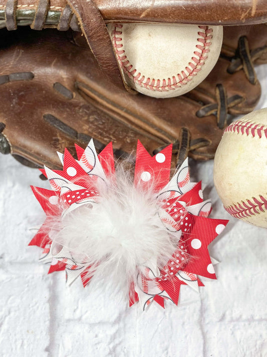 A mixture of red and white baseball printed grosgrain ribbons with a white marabou center