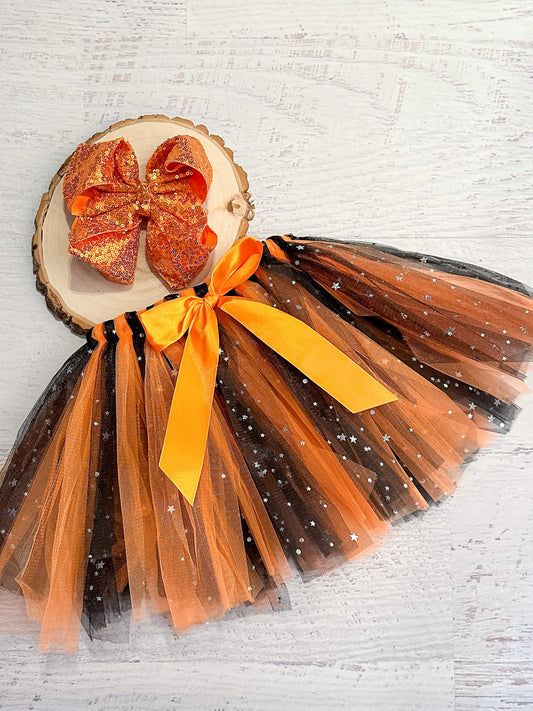 Black and orange sparkle tulle tied tutu for Halloween, dress up, and costumes.