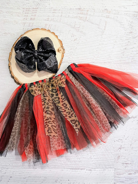Red, black, and leopard print tulle tutu with leopard print bow and sparkles.