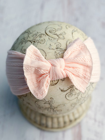 light pink cable knit bow headband