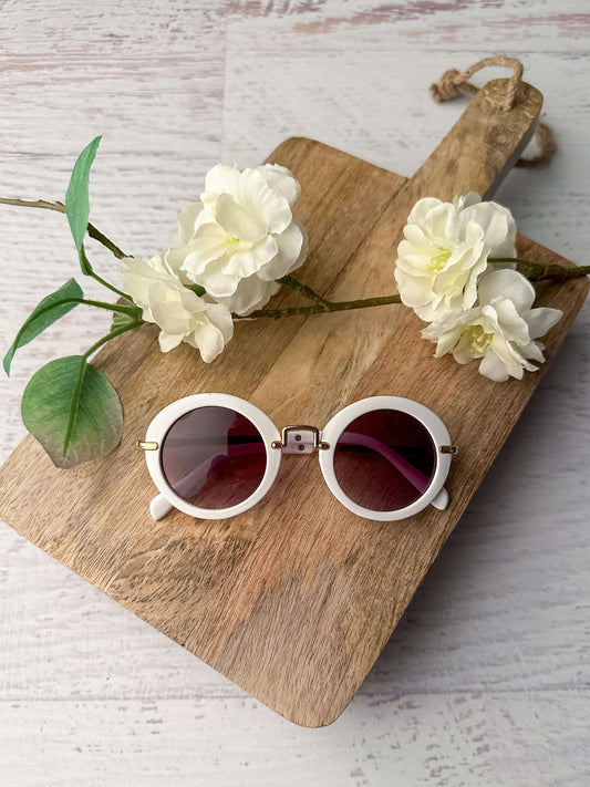 White framed sunglasses for girls.