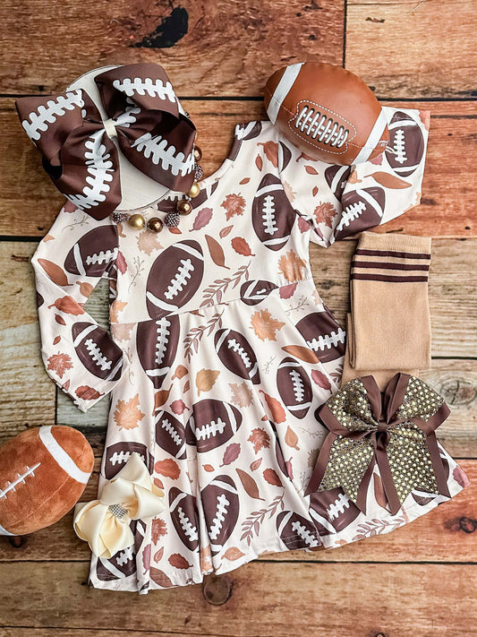 long sleeved twirl dress with footballs and leaves
