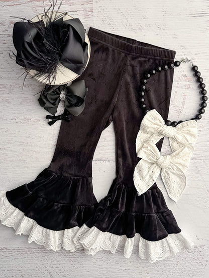 Black velvet leggings with white lace trim.