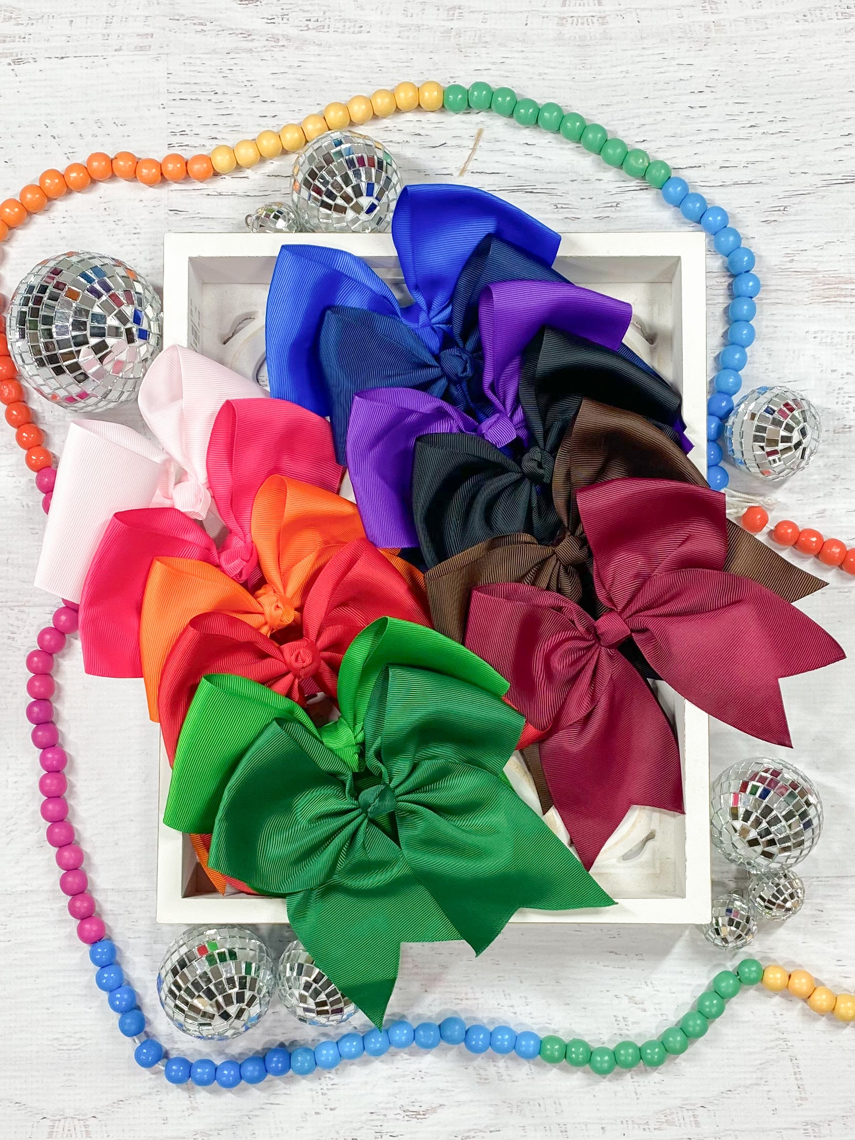 assortment of solid cheer bows in multiple colors