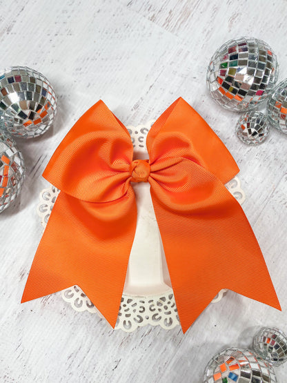 orange solid cheer bow with pony-o clip