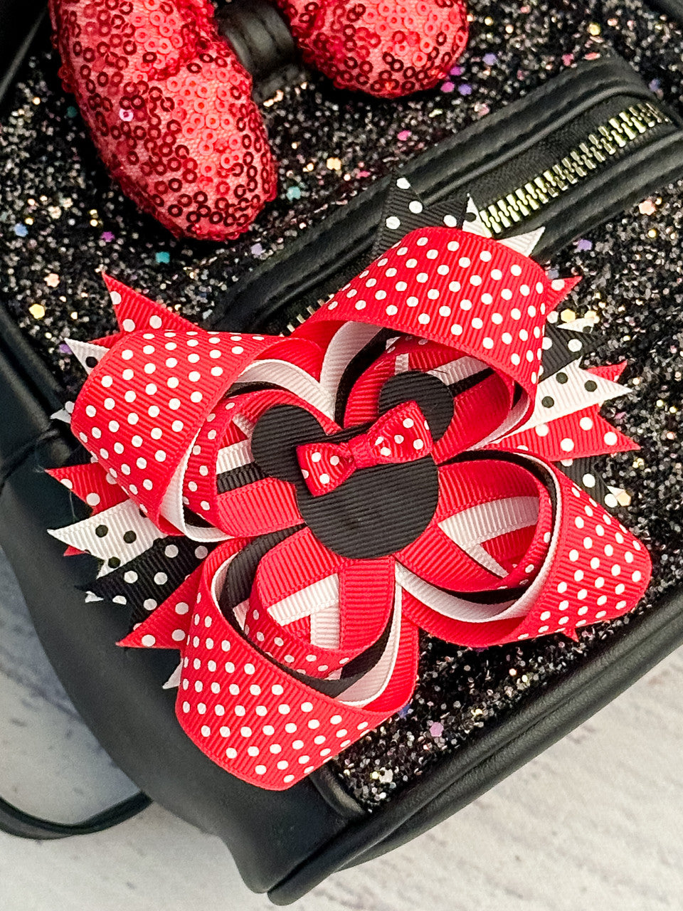 Polka dot Minnie Mouse hair bow in red.