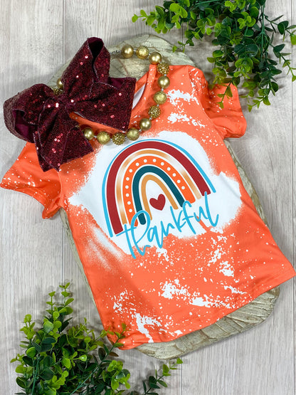 orange top with rainbow and "thankful"  screen print