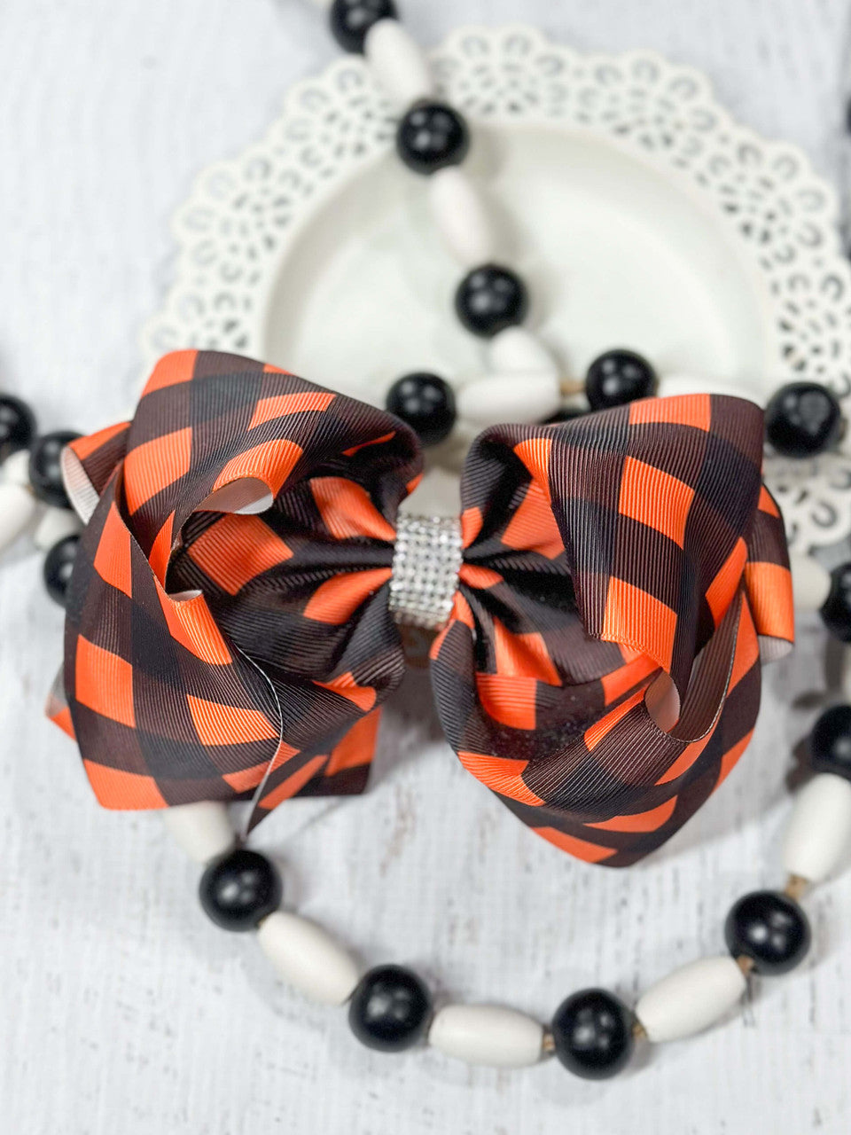 Orange and black buffalo plaid Texas size hair bow