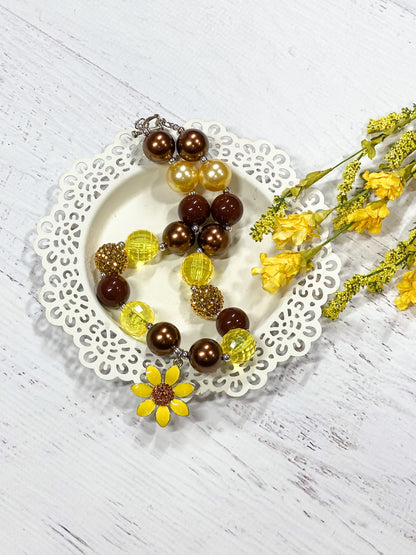 Bright sunflower pendant chunky bead necklace with a heart toggle closure, approximately 17"