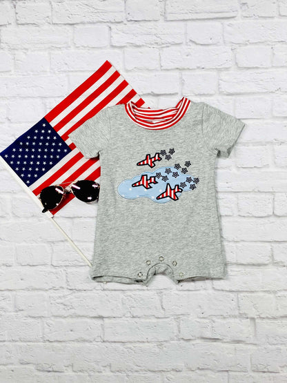 gray baby romper with flying planes