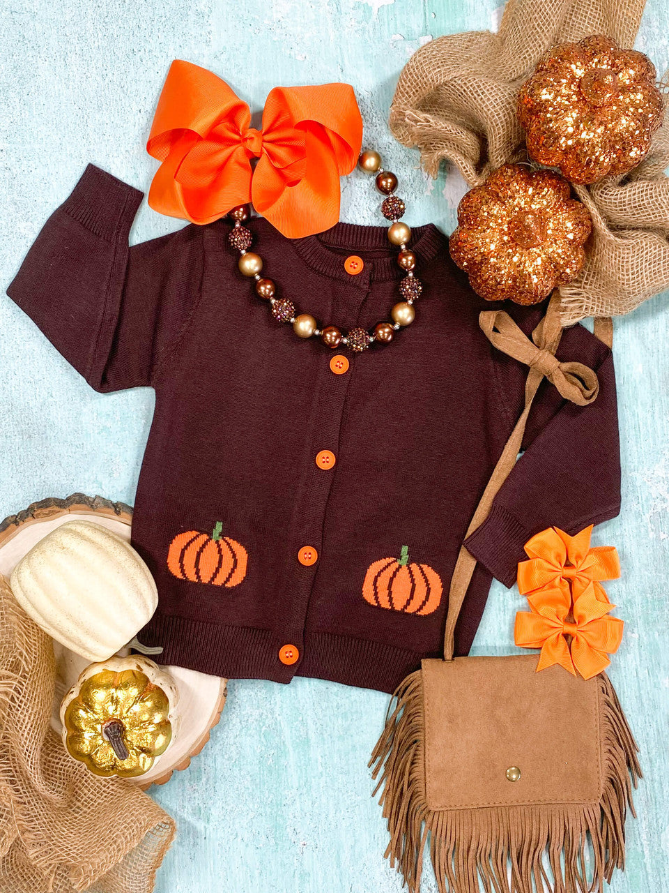 brown cardigan with orange buttons and cute pumpkins