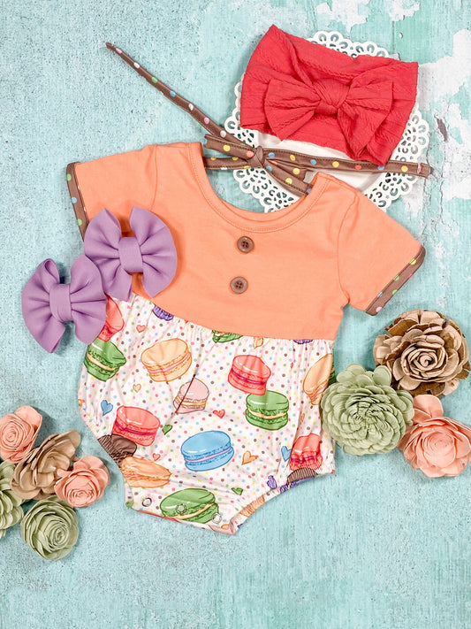 multi-colored macarons baby romper