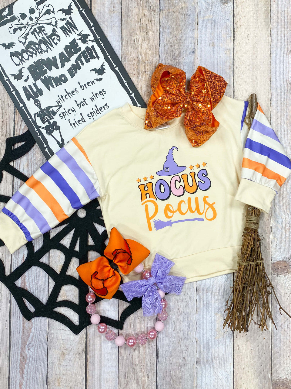 Hocus Pocus cream sweatshirt with purple and orange striped sleeves