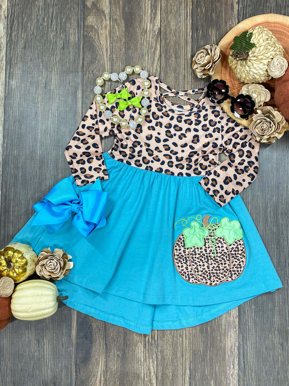 cheetah print top half and teal bottom half with animal print pumpkin dress