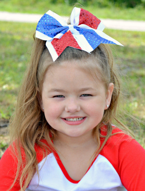 Red, white, and blue sequin cheer bow for girls on model