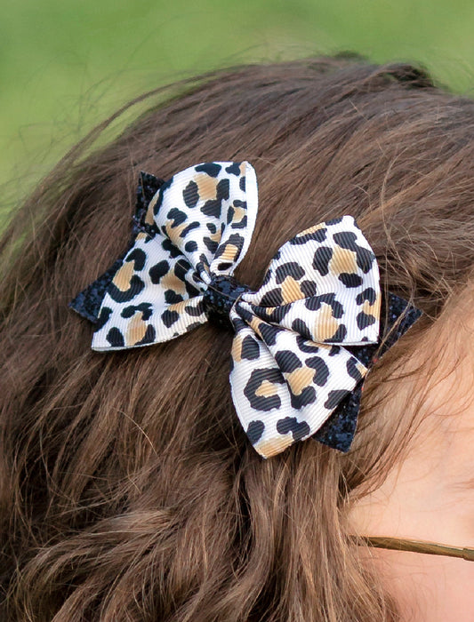 Animal print and black glitter bow - close up on model