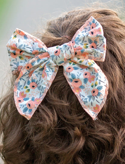 Coral floral print bow close up