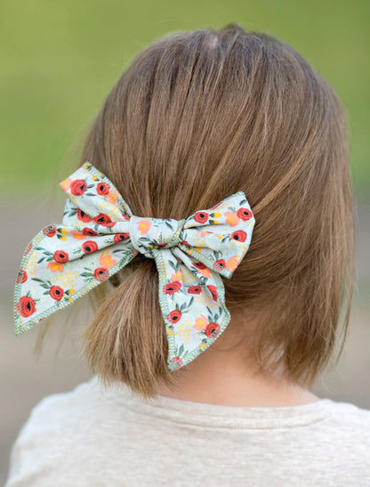 Floral print bow on model.