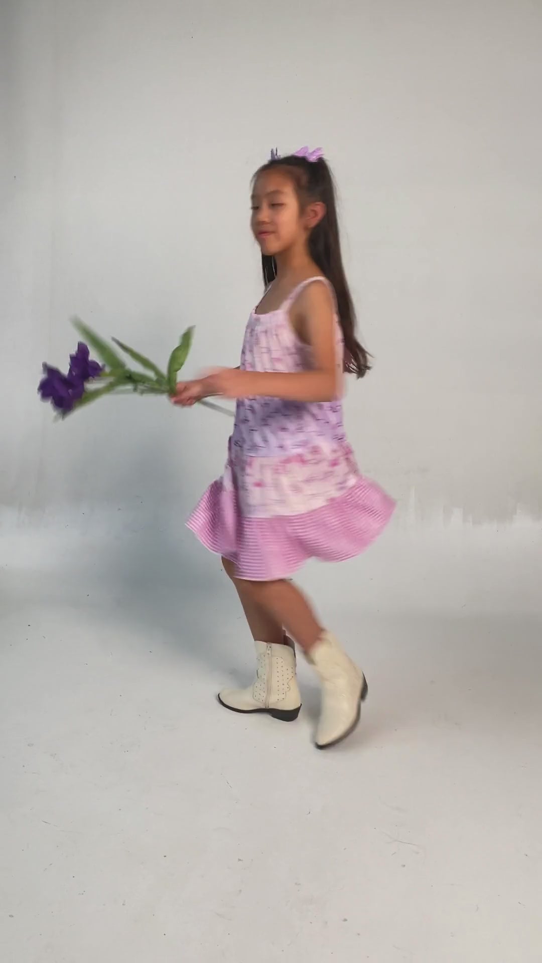 video of a model wearing our Purple Flower Dreams Tiered Dress