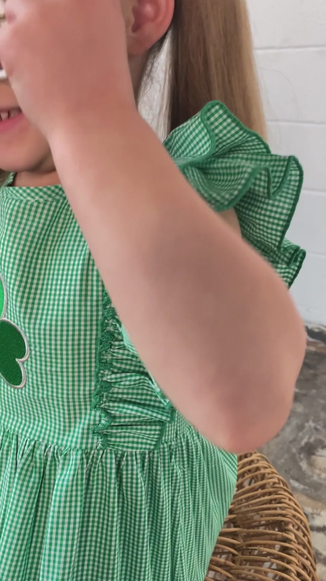 video of a model wearing our Embroidered Clover Green Gingham Dress