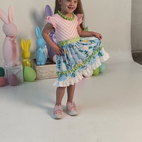 video of a model wearing our Wild About Daisies Tiered Twirl Dress