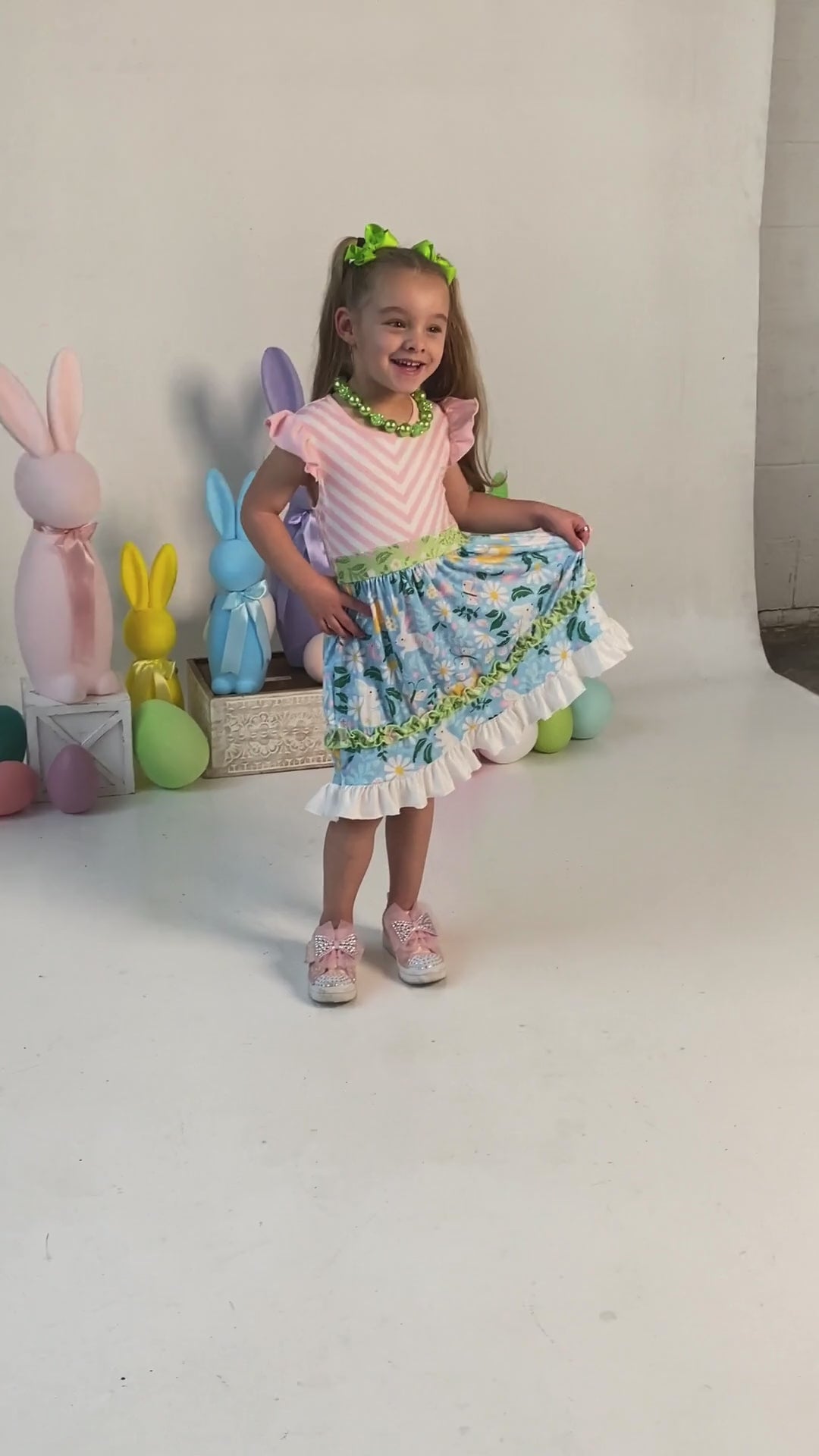 video of a model wearing our Wild About Daisies Tiered Twirl Dress